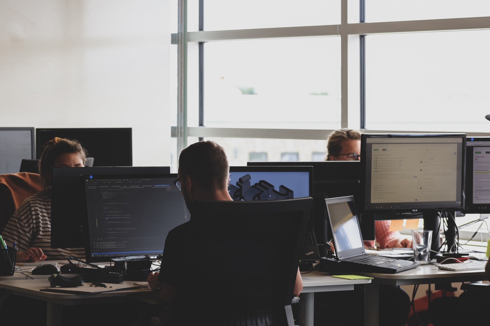 A team working with digital design tools